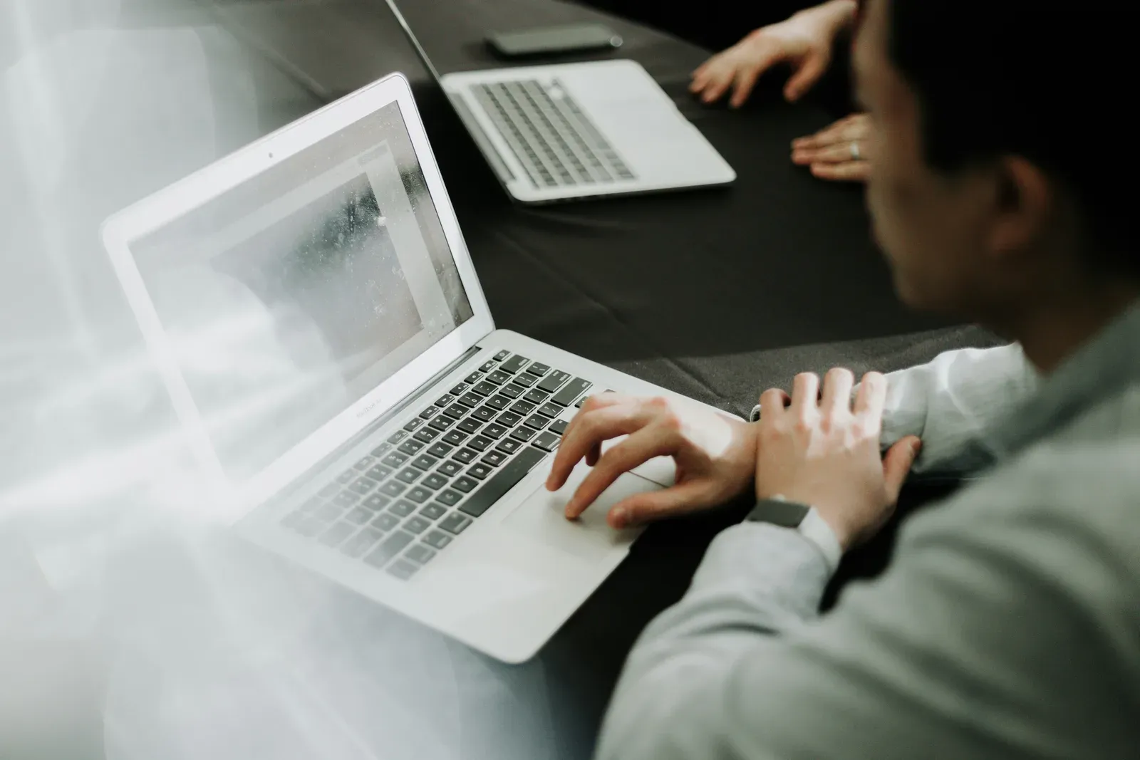 A team reviewing business performance on a laptop.